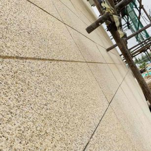 南充 黄金麻花岗岩荔枝面外墙干挂石材效果示例